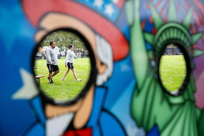 Festival-goers brave wet and rainy conditions for Urbandale's Fourth of July celebration on Tuesday, July 2, 2024, at Lion's Park.