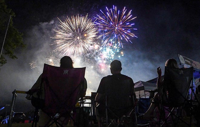 Children and families sit together watching fireworks during the 4th of July Freedom Celebration Fireworks and Concert in Williamston, S.C. Saturday, June 29, 2024.