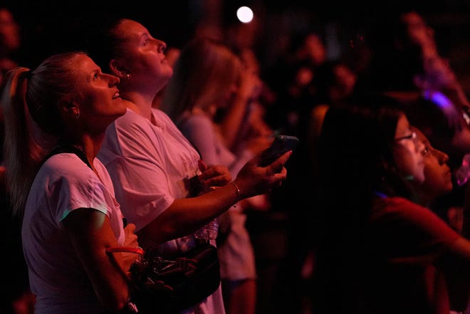 People watch the Lyndhurst, N.J. fireworks display from Riverside Ave, Tuesday, July 2, 2024.