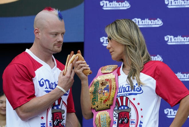 Nick Wehry, left, and Miki Sudo do a stare-down during a weigh-in for the 2024 Nathan's Famous Fourth of July International Hot Dog-Eating Championship at Hudson Yards in New York City on July 3, 2024. The contest will take place in Coney Island, New York on July 4, 2024.