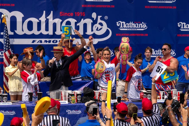 Miki Sudo wins the women's title with a record-breaking 51 hot dogs at Nathan's Annual Hot Dog Eating Contest on July 4, 2024 in New York City.