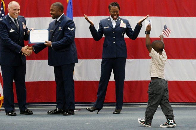 Airman 1st Class Imuzi Thompson’s son Mars Thompson walks on stage as he is father gets his certificate during the Barksdale Air Force Base first-ever naturalization ceremony for Barksdale Airmen Tuesday morning, July 2, 2024.