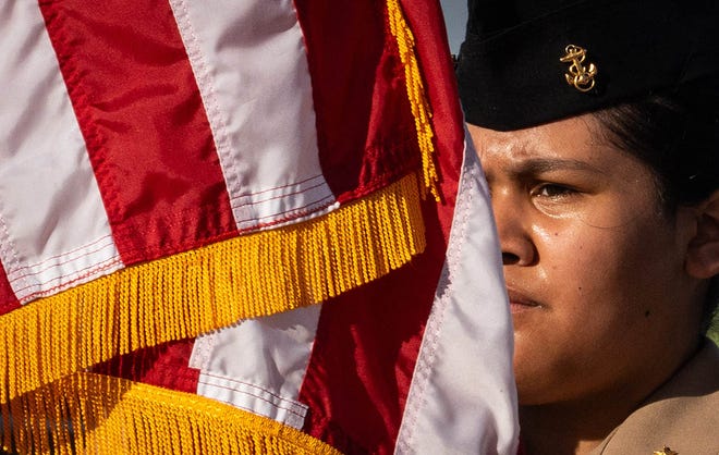 A member of the Stony Point Cedar Ridge Navy ROTC carries the American flag in the 2024 Annual Sertoma Independence Day Parade in Round Rock, Texas, July 4, 2024.